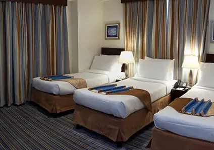 Room with 3 single beds