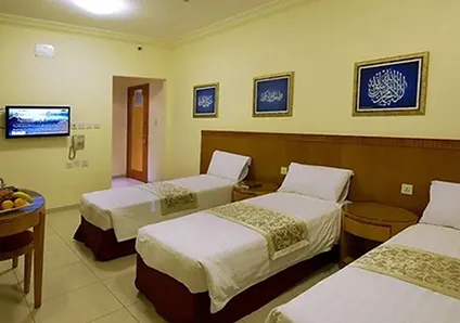Room with 3 single beds
