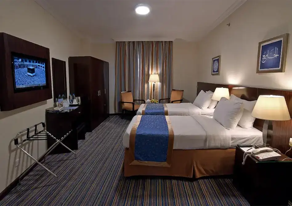 /media/umrah-images/2-single-beds-in-room.webp