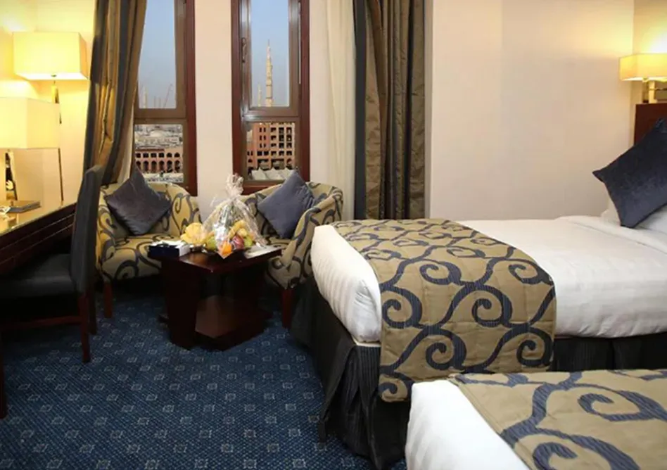 /media/umrah-images/2-single-beds-room%20%282%29.webp