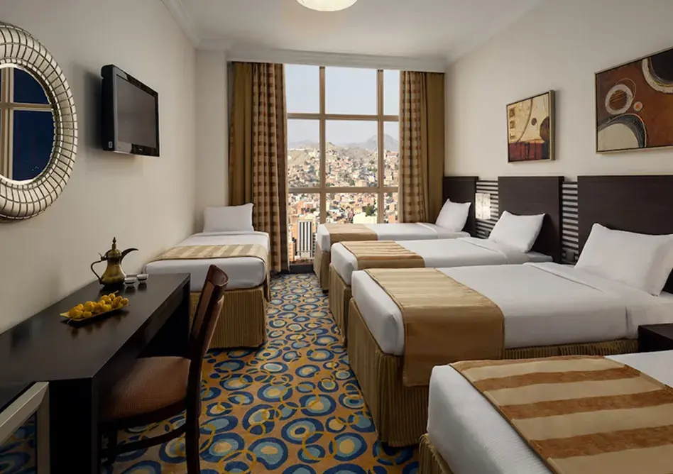 /media/umrah-images/five-single-beds-room.webp