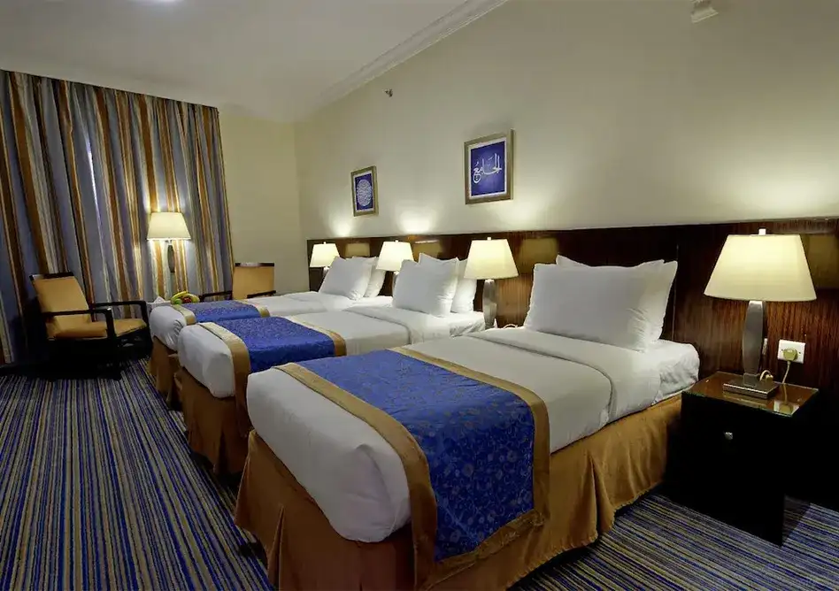 /media/umrah-images/room-view-with-3-single-beds.webp