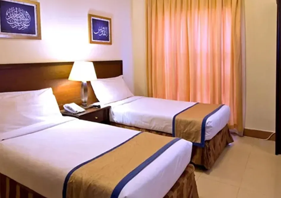 /media/umrah-images/room-with-2-single-bed%20%282%29.webp