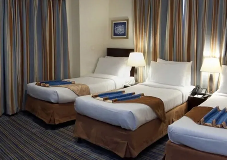 /media/umrah-images/room-with-3-single-bed.webp