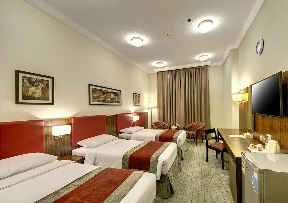 /media/umrah-images/room-with-3-single-beds%20%283%29.webp