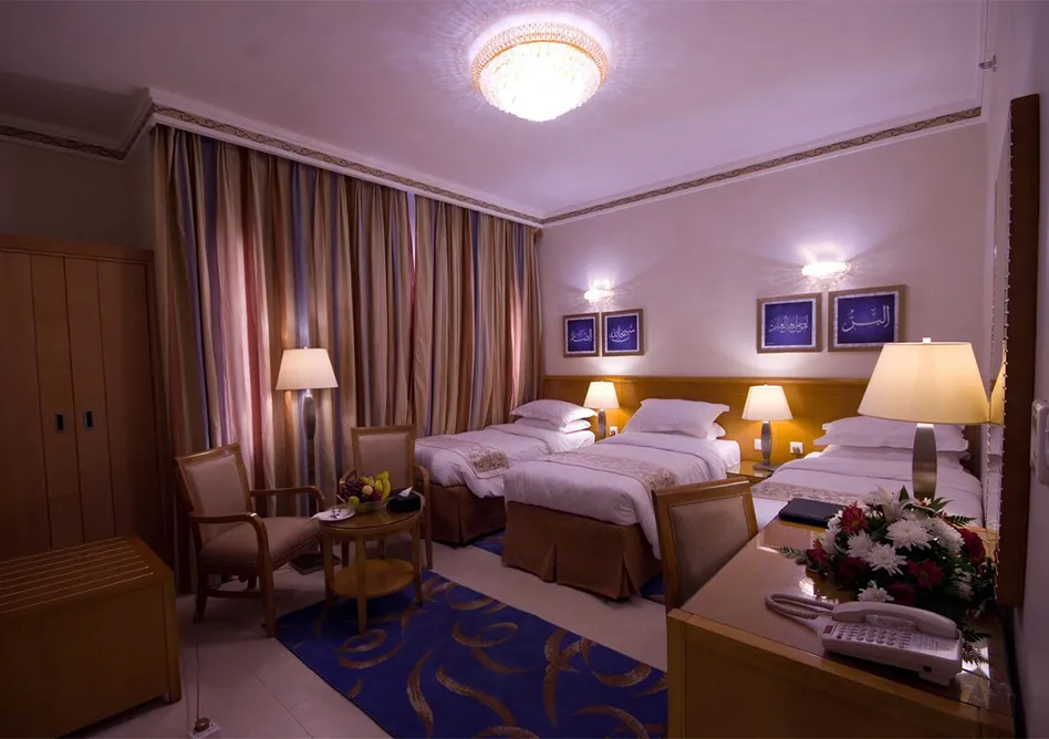 /media/umrah-images/room-with-3-single-beds%20%284%29.webp