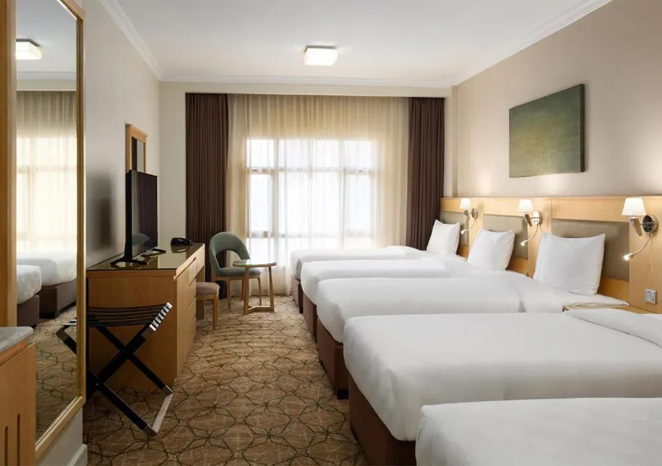 /media/umrah-images/room-with-4-single-beds%20%286%29.webp