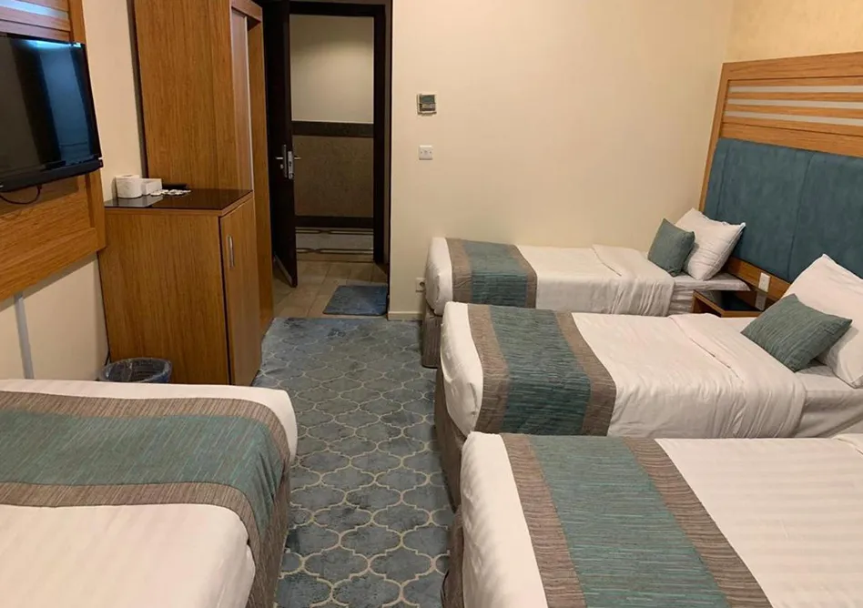 /media/umrah-images/room-with-4-single-beds-%20%281%29.webp